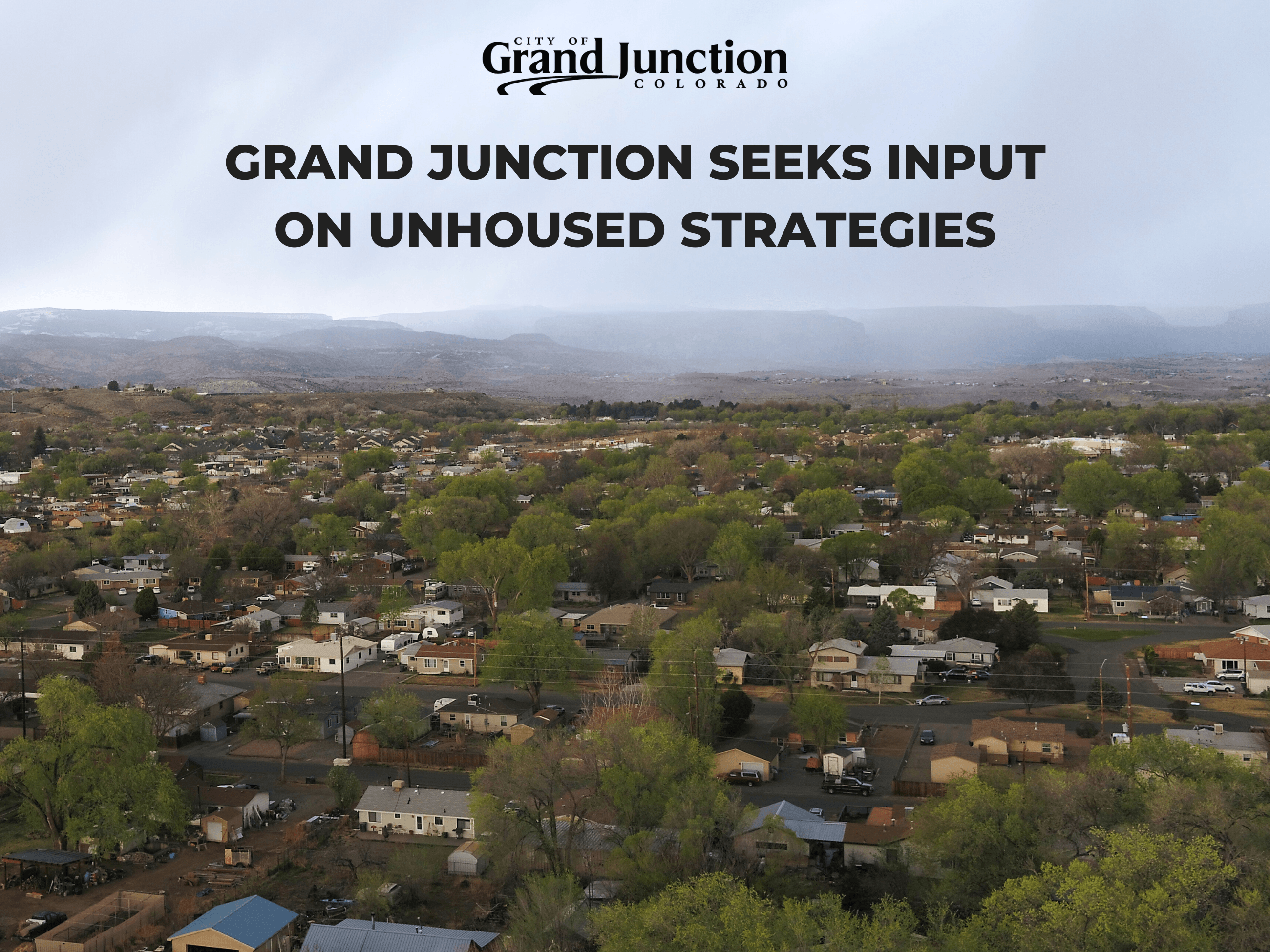 Ariel view of city with houses and trees. Text on graphic.