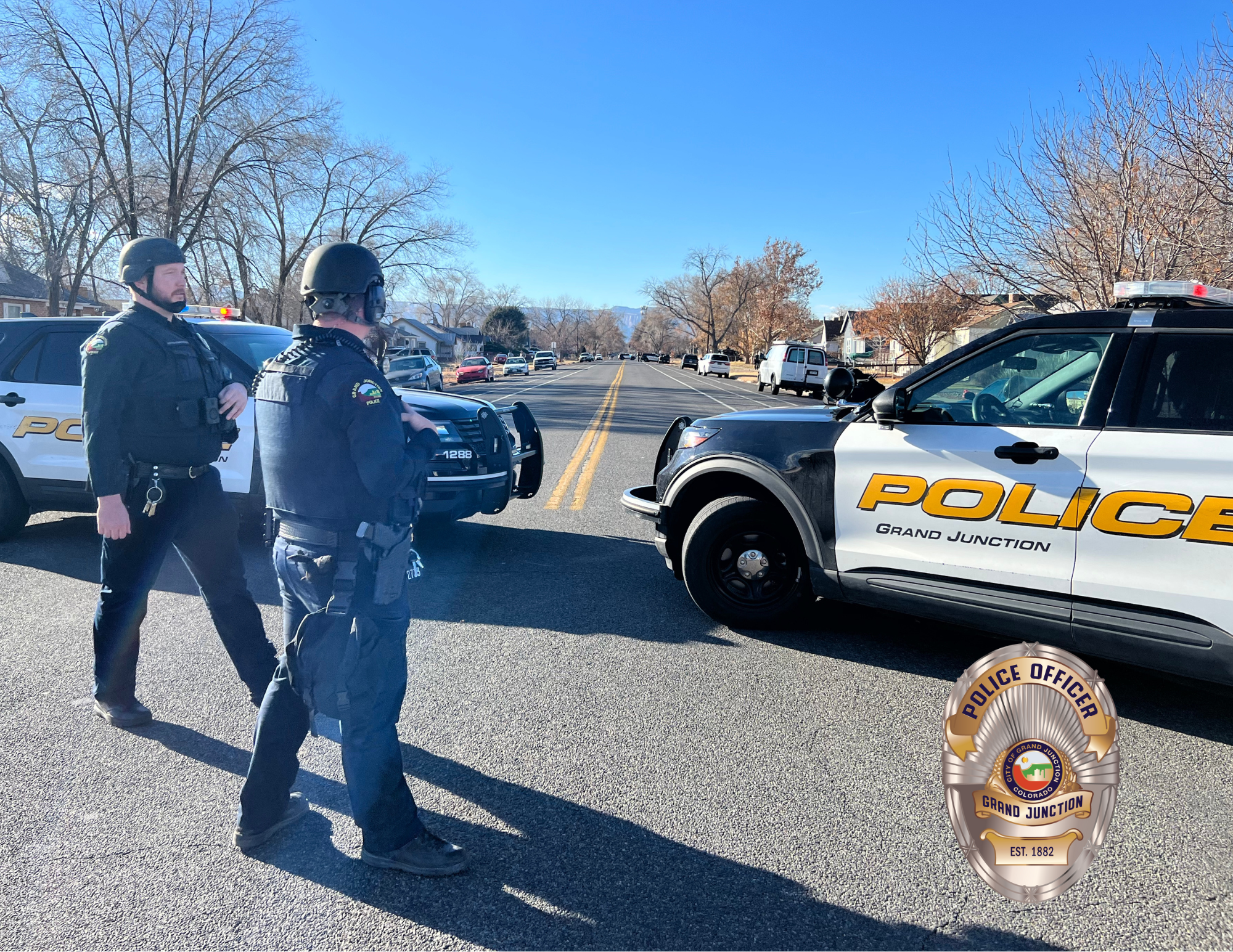 two officers blocking road during incident.
