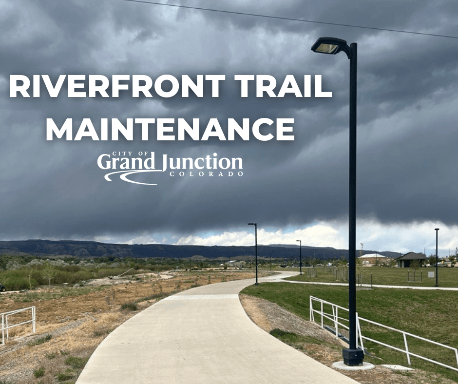 The riverfront trail looking west with mountains in the background. Text on the graphic. 