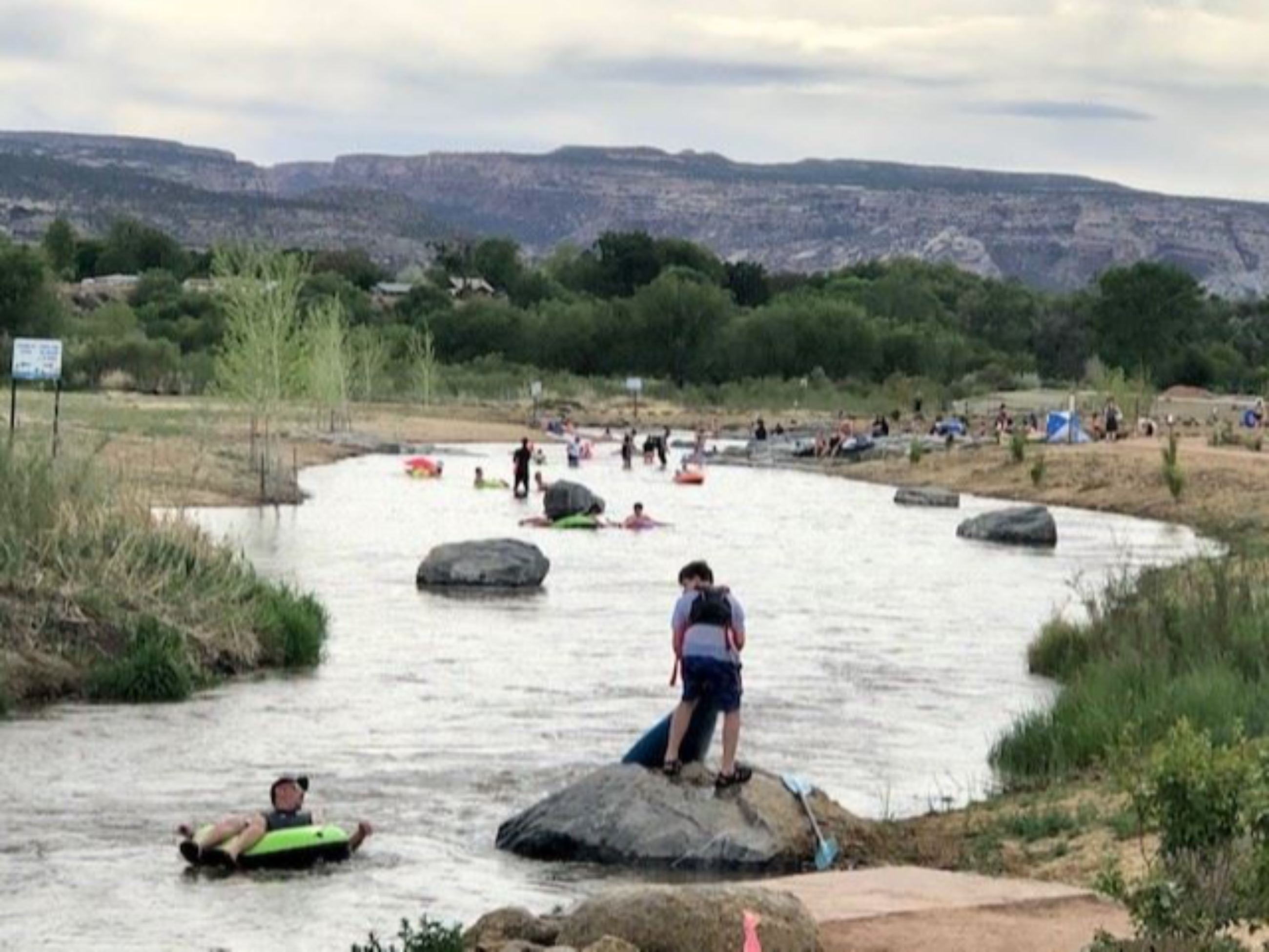 People tubing down Las Colonias River Park