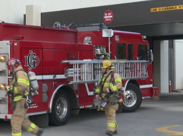 firefighters training in front of fire truck
