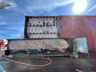 GJFD Fire, burned dumpster and side of a building