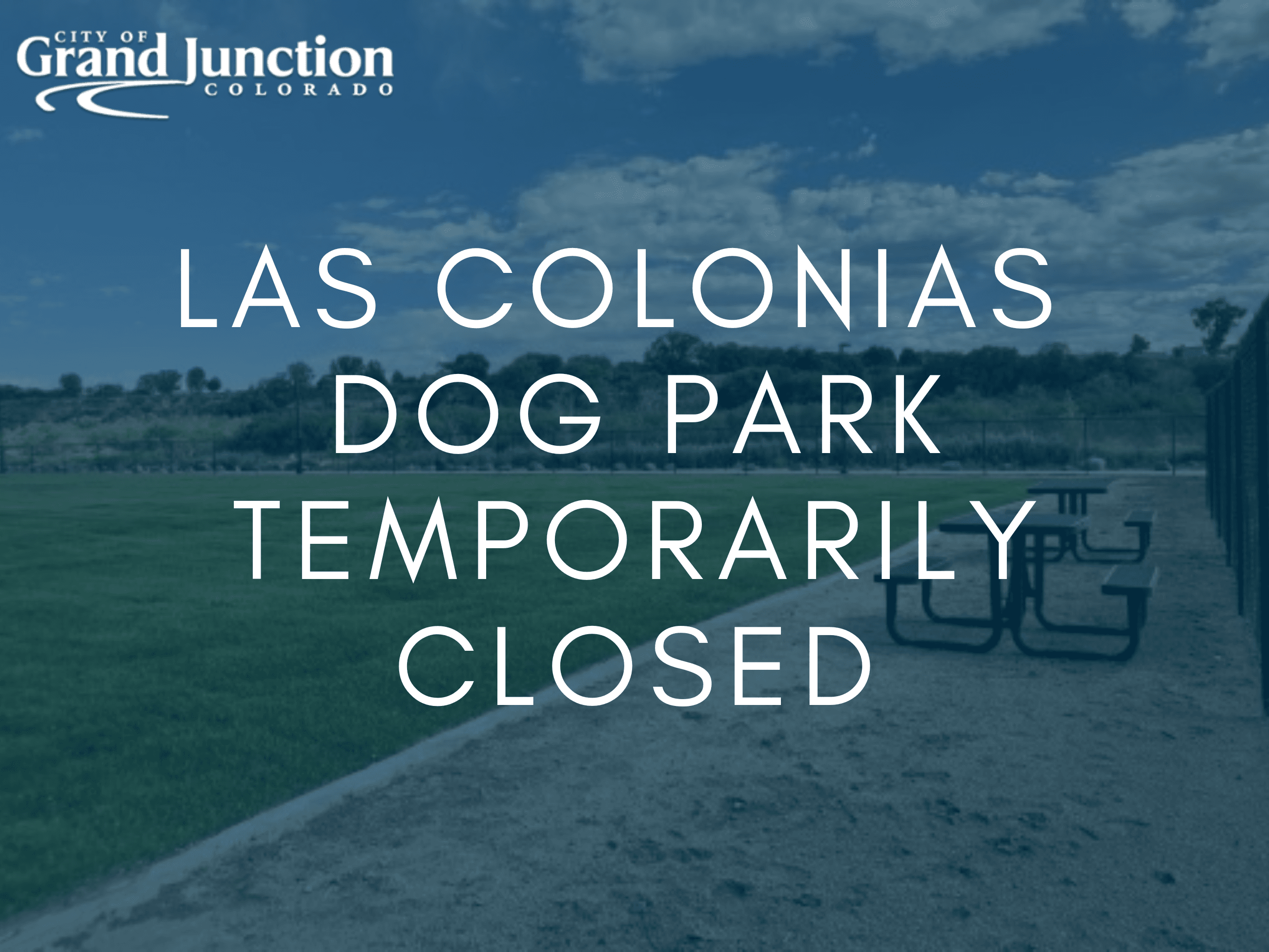 bench with grassy field blue graphic overlay that reads las colonias dog park temporarily closed