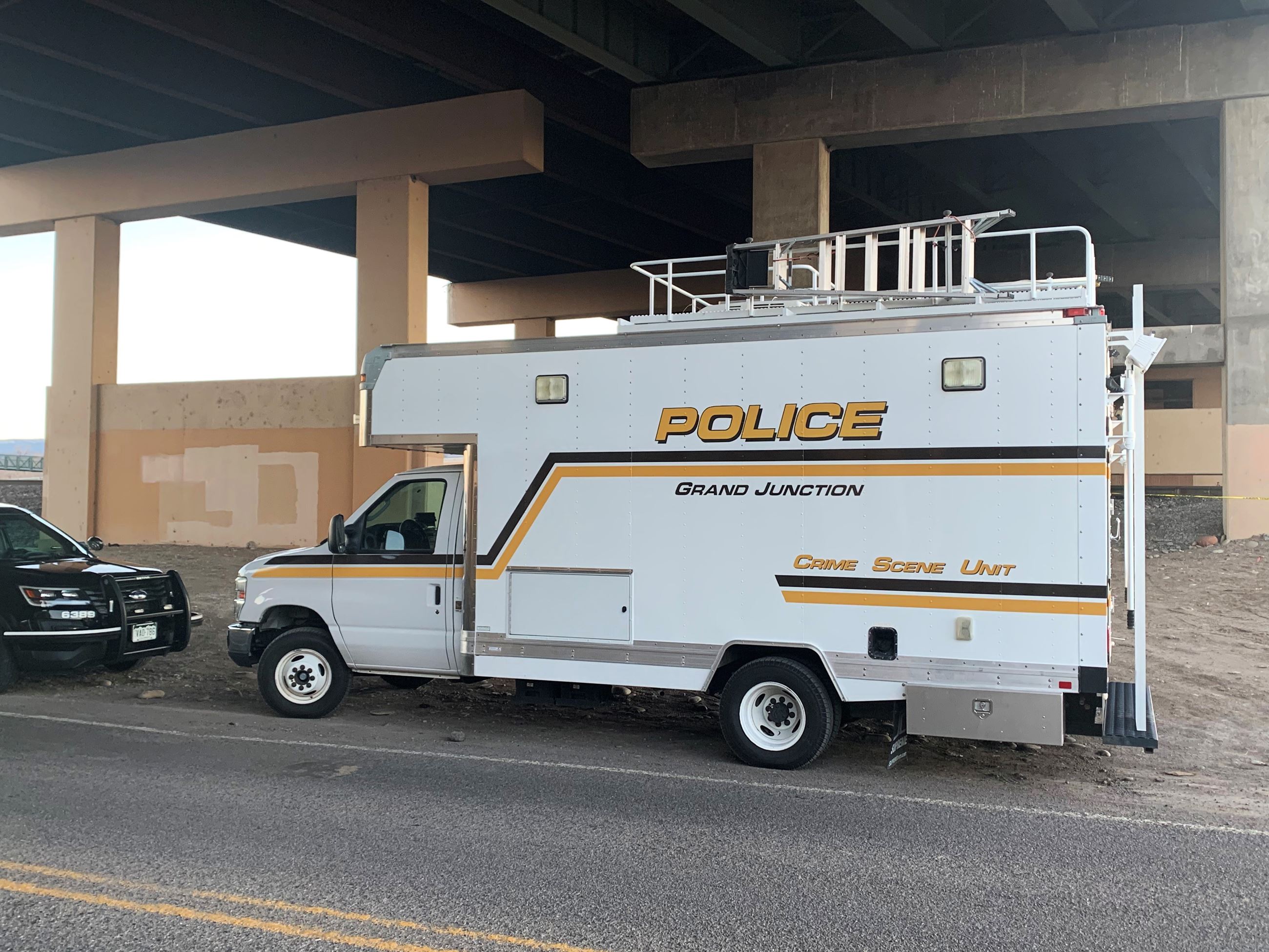GJPD Property and Evidence Truck pictured sitting under overpass during crime scene investigation