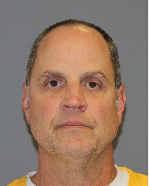 photo of Caucasian man in yellow shirt