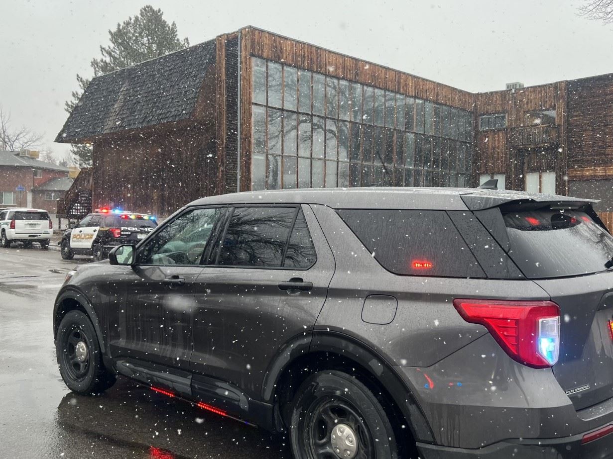Police Vehicles in front of apartment building